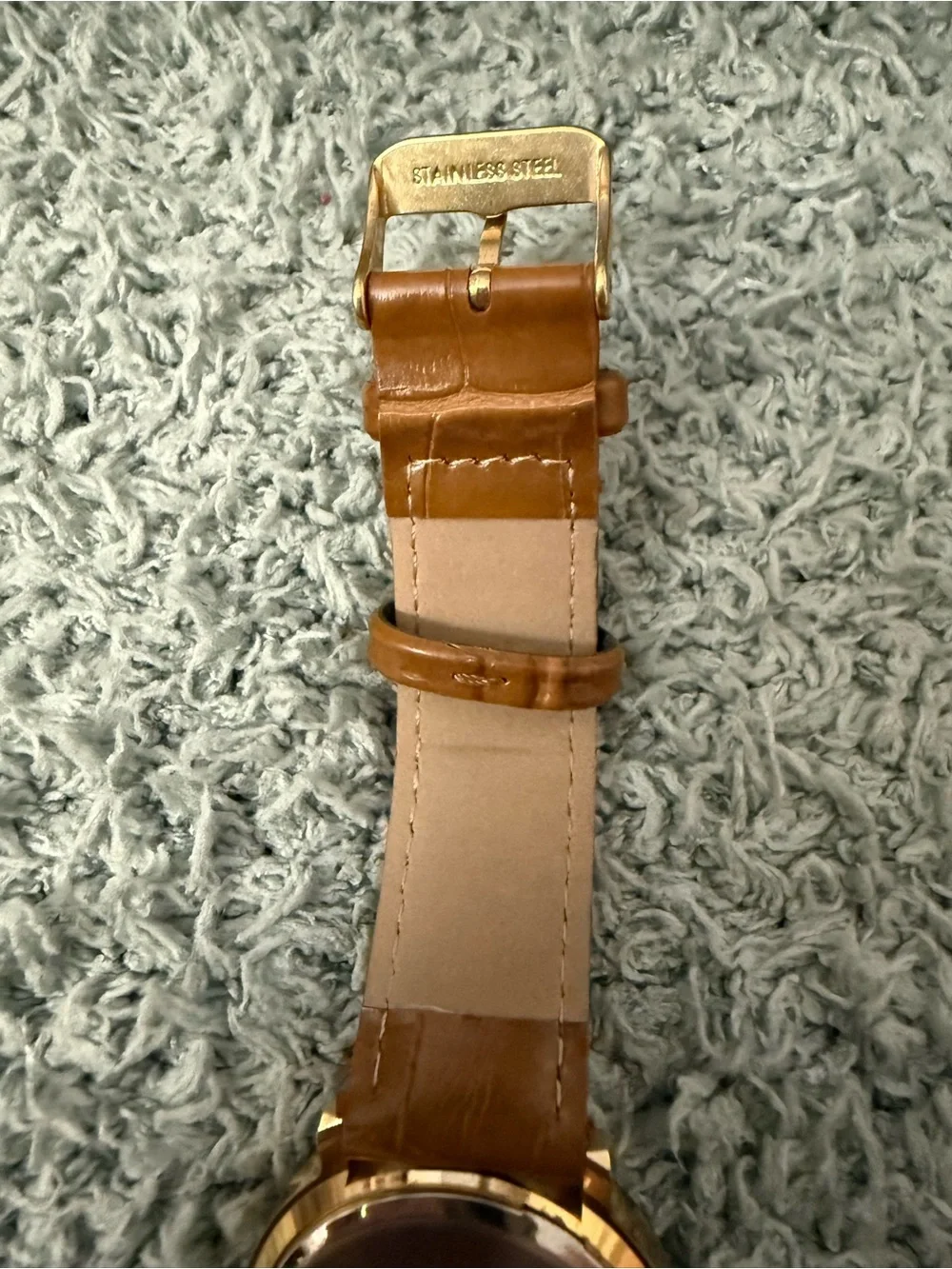Disney Winnie the Pooh watch features a crystal-bezel dial and dangling charms o